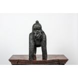 A black painted polystone gorilla with young, 20th C.