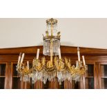 A German gilt metal, gilt wood and cut-glass ten-light chandelier after a design by Karl Friedrich S