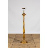 A large gilt carved wooden candlestick mounted as a lamp, 19th C.