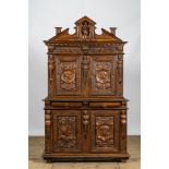 A richly carved baroque-style oak and walnut four-door cabinet, 19th C.