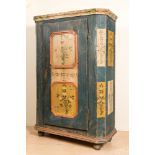 A German painted wooden one-door cupboard, 19th C.