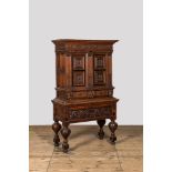 An oak and partly ebonised wooden cabinet on foot, 19th C. with older elements