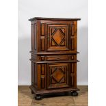 A walnut two-door cabinet with ebonised accents, 17th C.