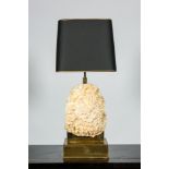 A brass table lamp mounted with a quartz rock, 2nd half 20th C.