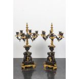A pair of Franch partly gilt bronze 'atlants' candelabra, 19th C.