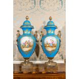 A pair of large Sevres-style lidded vases in 'Bleu celeste' porcelain with gilt bronze mounts, signe