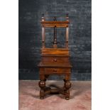 An oak linen press on foot with ebonised accents, 19th C.