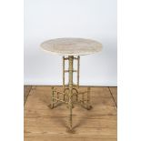 A cast iron tripod side table with marble top, 20th C.