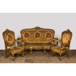 A Louis XV-style gilt wooden salon set comprising a three-seater sofa and two armchairs, 20th C.