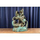 A large faux bronze-patinated pottery group with Saint George beating the dragon, mid 20th C.