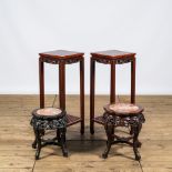 A pair of Chinese wooden square stands and two round ones with marble tops, 20th C.