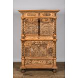 A German baroque leached walnut three-door cabinet, 18th C. with later elements