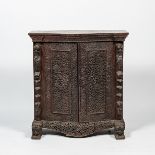 An Anglo-Indian colonial carved wooden two-door cabinet, 19th C.