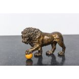 A gilt bronze model of a lion, 19th C.