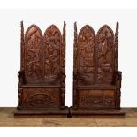 A pair of imposing wooden throne seats with relief design, 20th C.