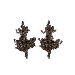 A pair of French patinated bronze seven-light wall lights, 20th C.