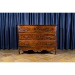 An Italian walnut chest of drawers, 18th C.