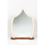 A large mirror set in faux ivory tusks, 20th C.
