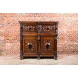 A Flemish ebonised and oak wooden four-door cabinet, 17th C.