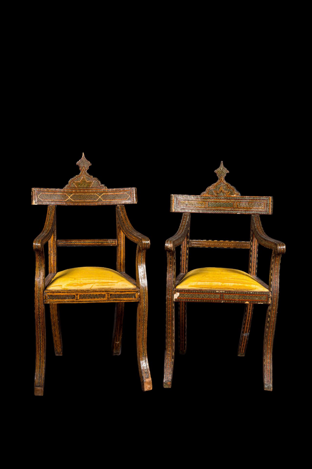 A pair of North African bone-inlaid wooden chairs with silk upholstery, 19th C