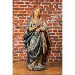 A large polychrome wooden sculpture of a female saint, ca. 1600