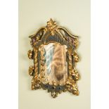 A painted and partly gilt carved wooden 'columns' mirror with cabochons, 19/20th C.