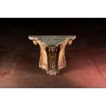 A patinated plaster console with patinated wooden top, 20th C.