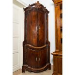 A large baroque-style four-door corner cupboard, probably Italy, 18/19th C.
