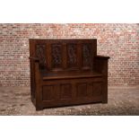 An oak wooden chest-bench, 16th C. and later