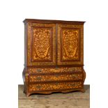 A Dutch mahogany floral marquetry cabinet with two doors and three drawers, 18/19th C.