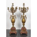 A pair of large gilt brass candelabra on red marble bases, 19th C.