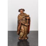 A polychrome wooden figure of John the apostle holding a chalice, 17th C.