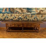 A walnut console table with four drawers, 19th C. with older elements