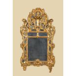 A gilt wooden mirror with floral design, 18th C.