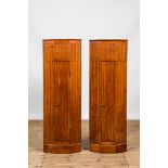 A pair of fluted wooden corner cabinets, 19/20th C.