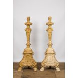 A pair of imposing patinated and gilt church candlesticks, 20th C.