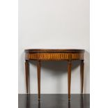 An Italian marquetry demi-lune gaming table with inlaid design of bow and arrows, 18/19th C.