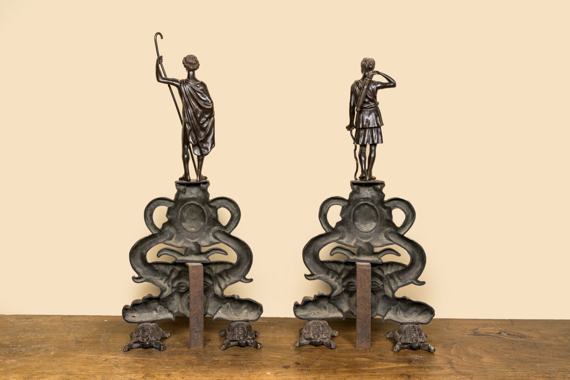A pair of patinated bronze chenets with Greek gods, 19th C. - Image 2 of 2