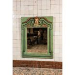 A rectangular polychrome wooden neoclassical mirror with central mascaron, 19th C.