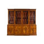 A large English magohany four-door break fronted library bookcase, 19th C.