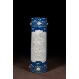 A large blue and white Arita porcelain cylindrical vase or umbrella stand with molded design, Japan,