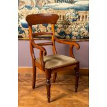 An English mahogany armchair, 19th C.