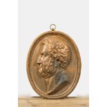 A gilt bronze plaque with a profile portrait of a man, 19th C.