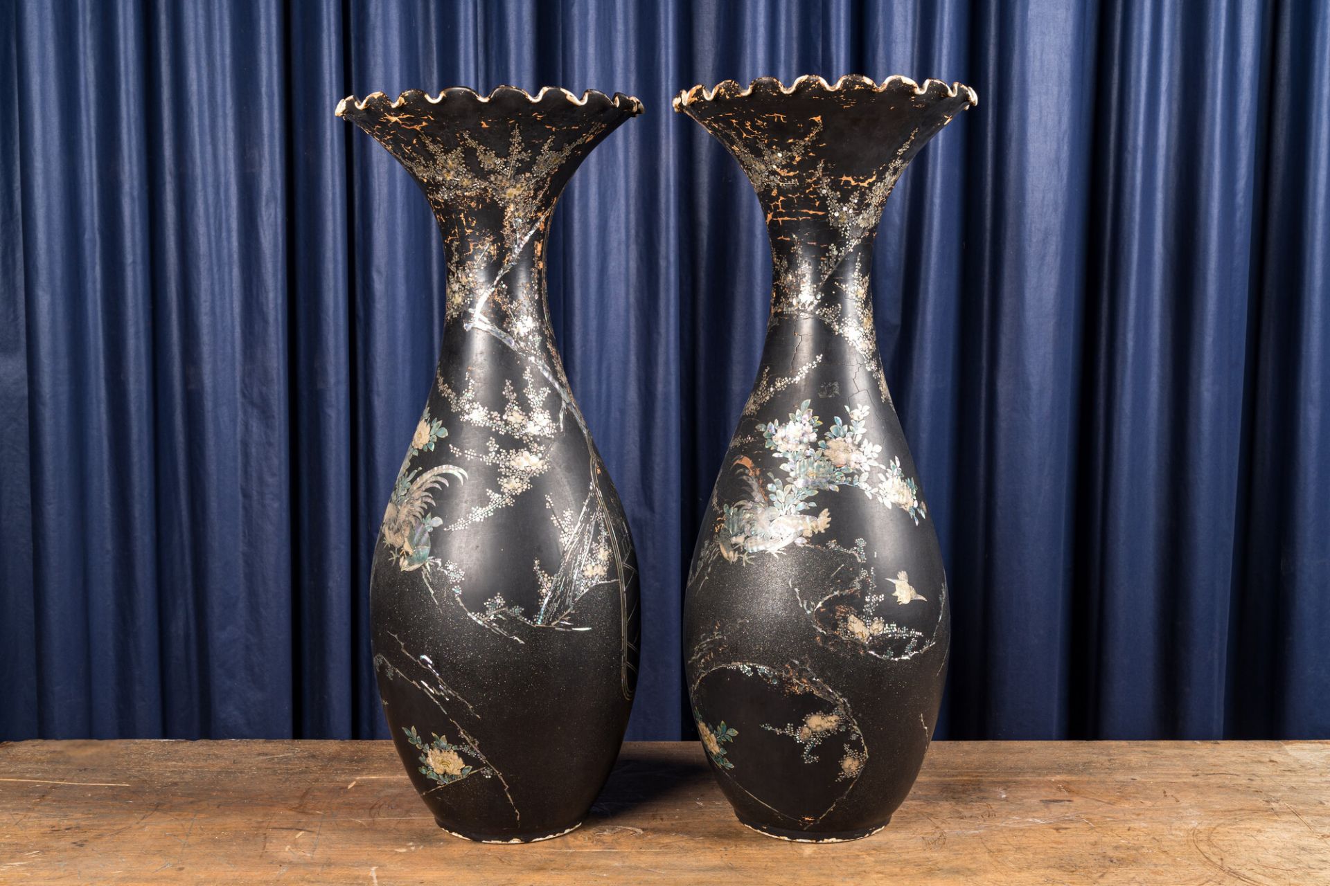 A pair of large mother-of-pearl-inlaid black-lacquered Japanese vases with fan-shaped rims, Meiji, 1