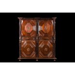 An imposing baroque-style parquetry oak four-door cupboard, 19th C.