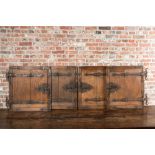 Four wrought iron-mounted oak doors, 18/19th C.