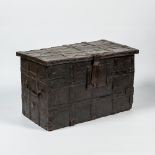 A wrought iron-mounted wooden coffer with leather upholstery, 17th C.