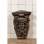 A patinated concrete wall console with mascaron, 20th C.