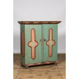 A polychrome wooden two-door cabinet with inside landscape design, 19th C.