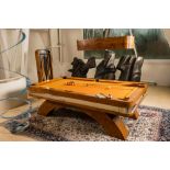 A burl wood veneered billiard table with accompanying lighting and cue holder, 20th C.